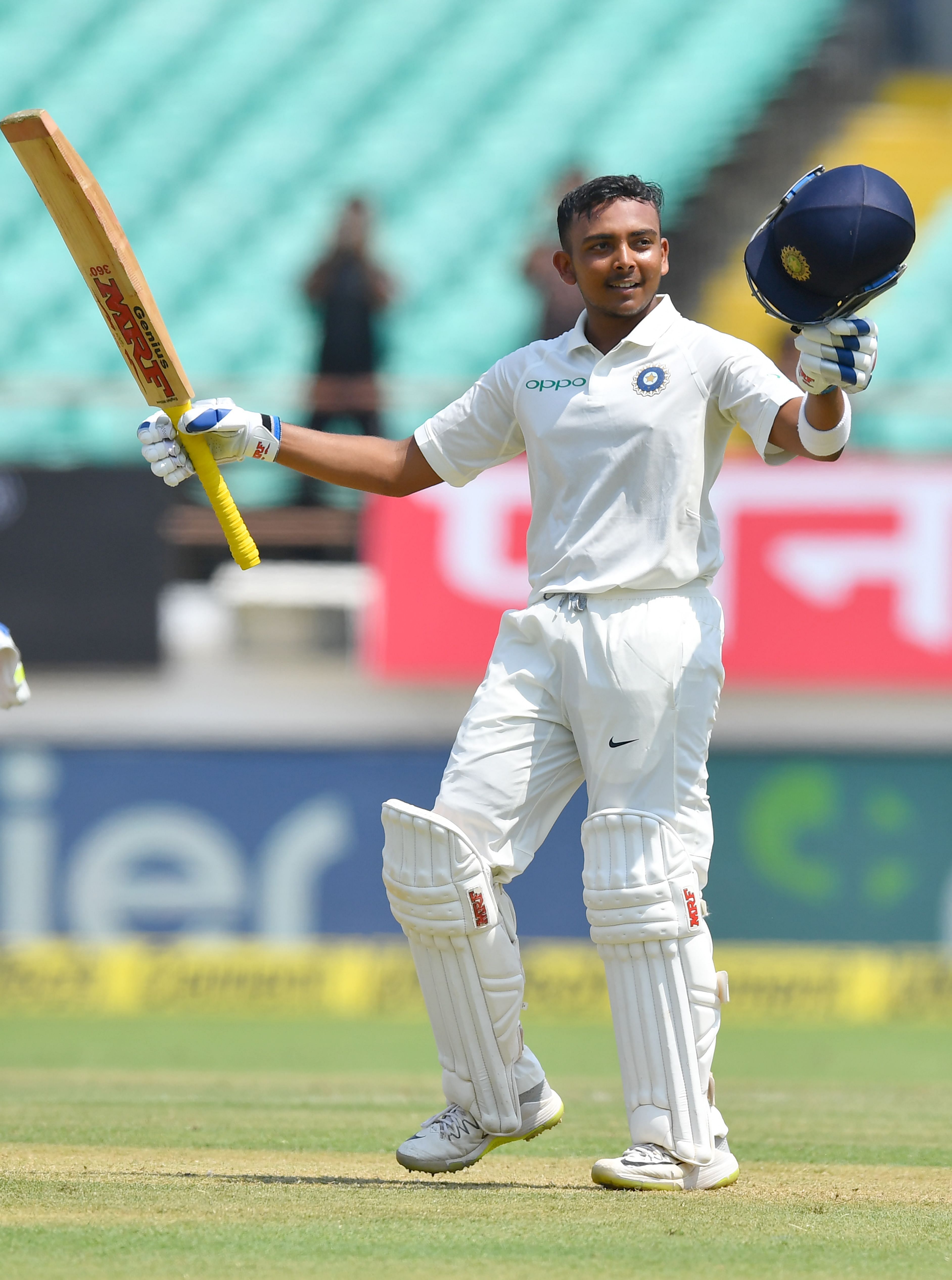 Prithvi Shaw celebrates after scoring a century during the first day of the first Test against West Indies in Rajkot on Thursday. AFP
