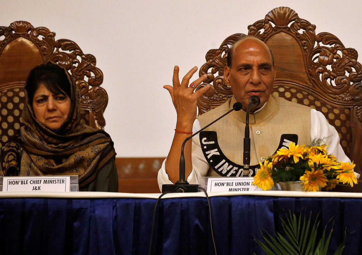 Jammu and Kashmir Chief Minister Mehbooba Mufti and Union Home Minister Rajnath Singh attend a press conference in Srinagar