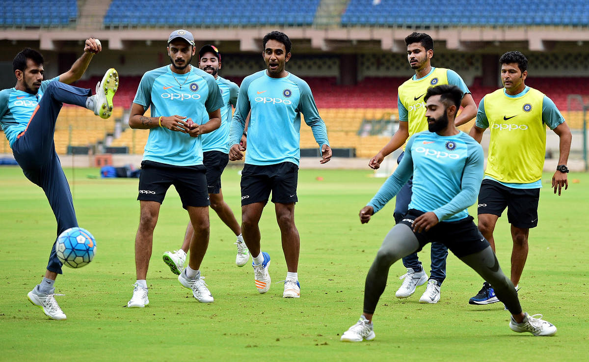 BIG TEST: India 'A' players warm-up with a round of football ahead of their practice session at the Chinnaswamy Stadium in Bengaluru on Friday. DH Photo/ Krishnakumar P S