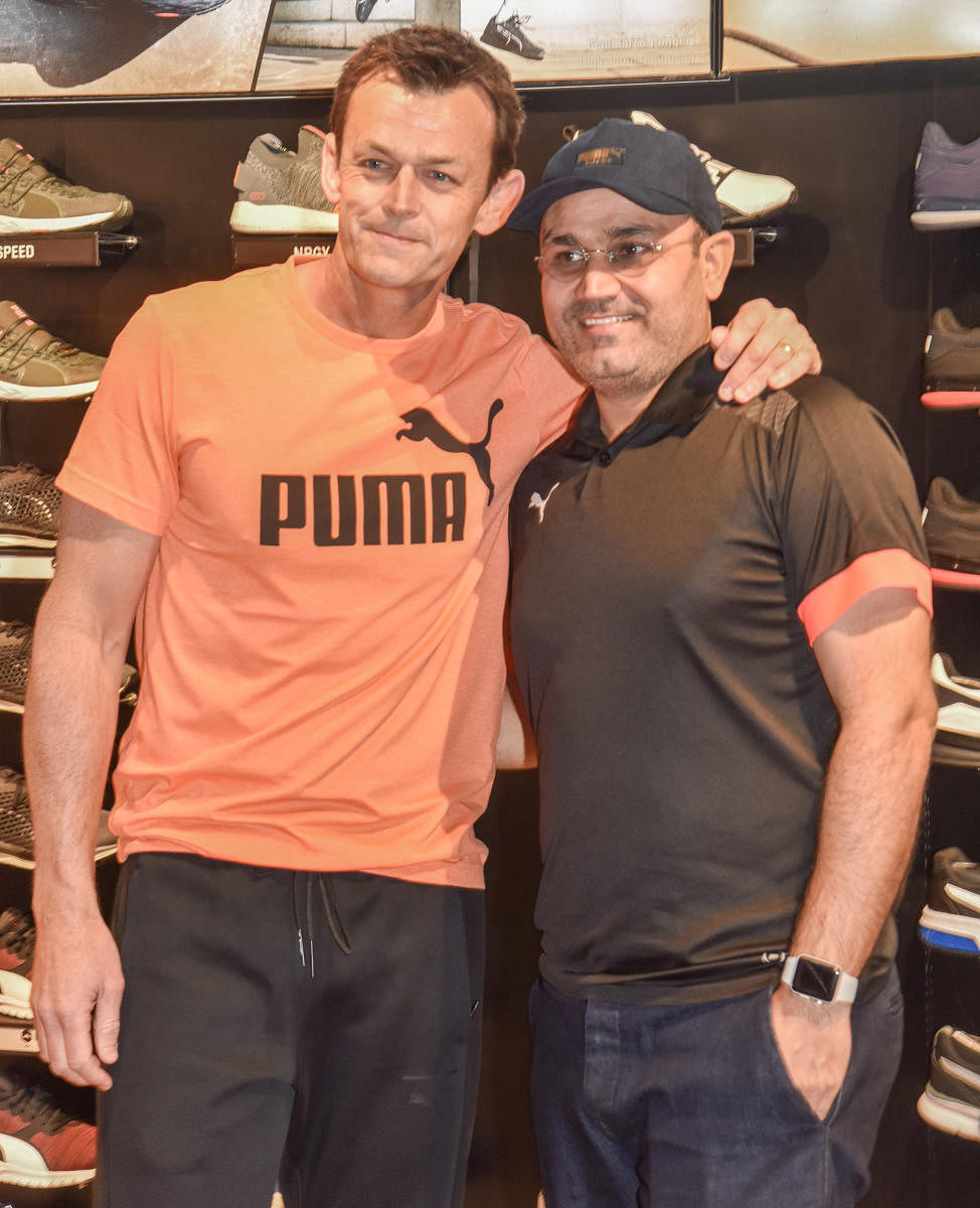 TWO OF A KIND Former Australian cricketer Adam Gilchrist (left) and former India opener Virender Sehwag at a promotional event in Bengaluru on Sunday. DH PHOTO/ S K DINESH