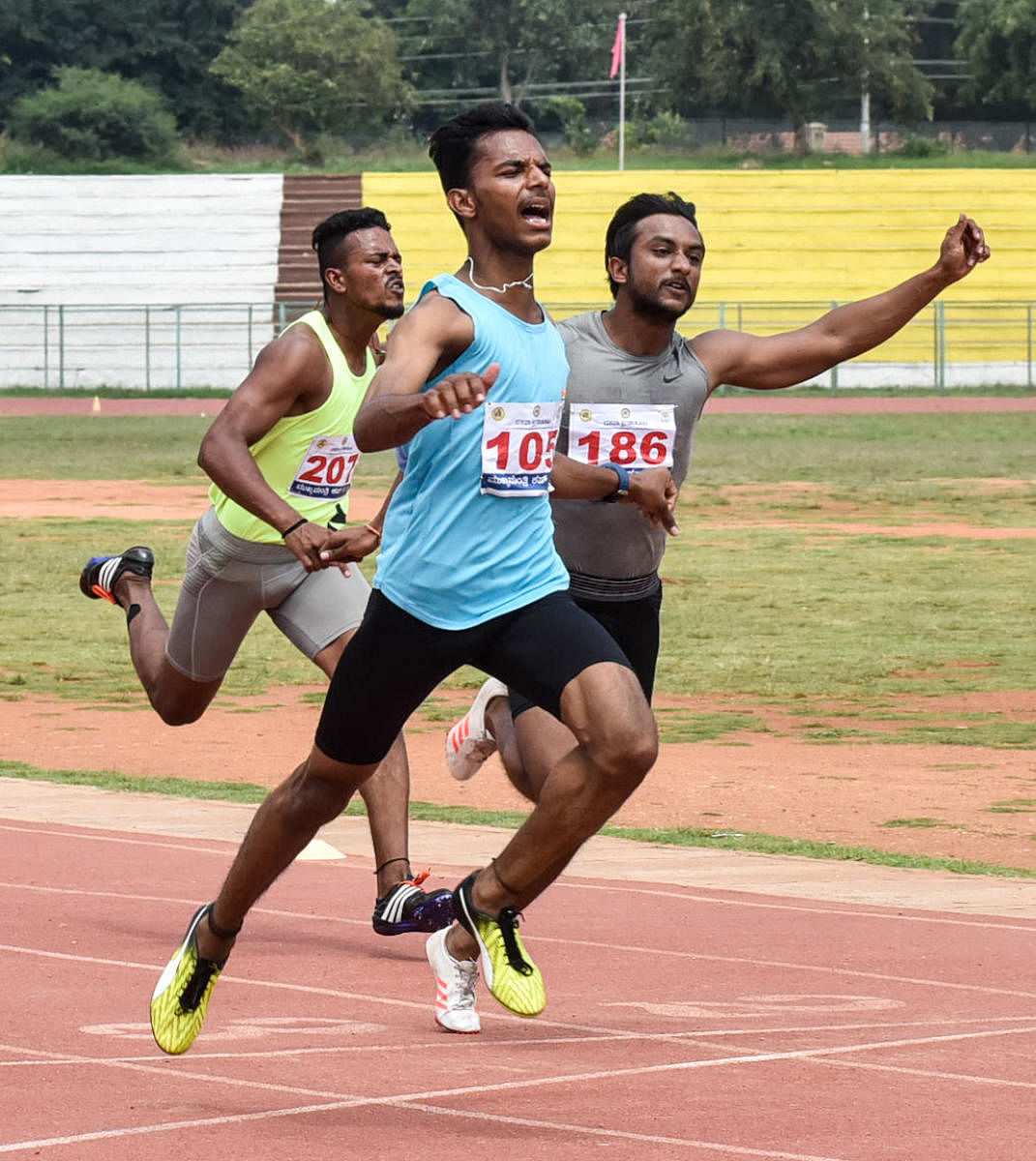 Bengaluru's Shashikanth (left) en route to victory in the 100m race at the Dasara Games athletics event in Mysuru on Tuesday. DH PHOTO/ Savitha BR