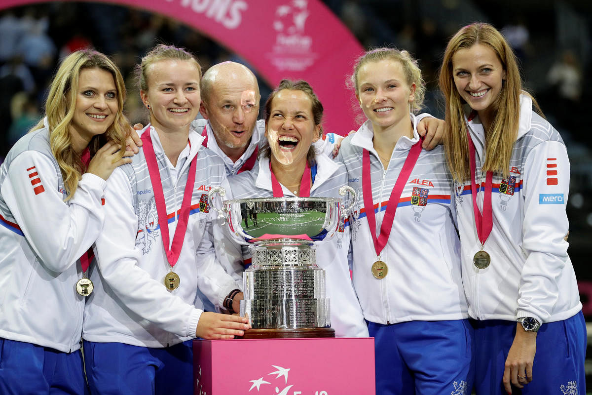 The Czech Republic team celebrate with the Fed Cup after blanking United 3-0 on Sunday. REUTERS