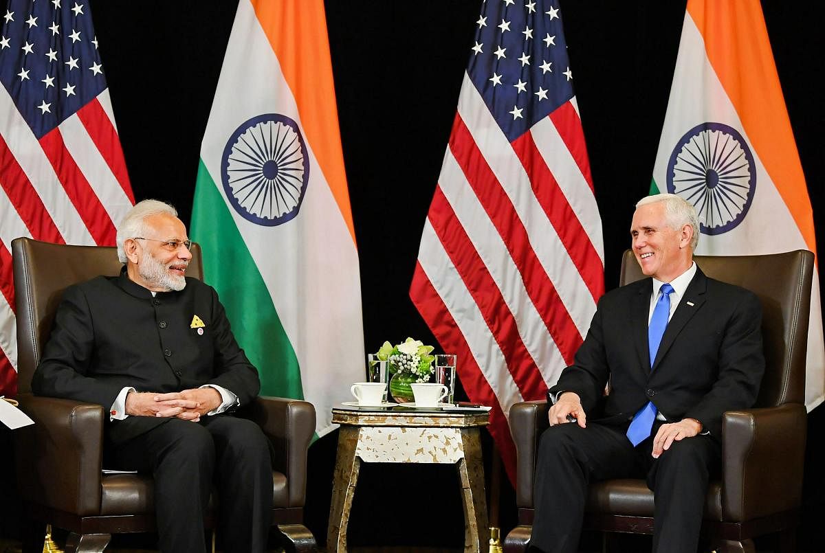 Prime Minister Narendra Modi (L) and the US Vice President Michael Richard Pence, on the sidelines of East Asia Summit in Singapore on Wednesday. PTI photo