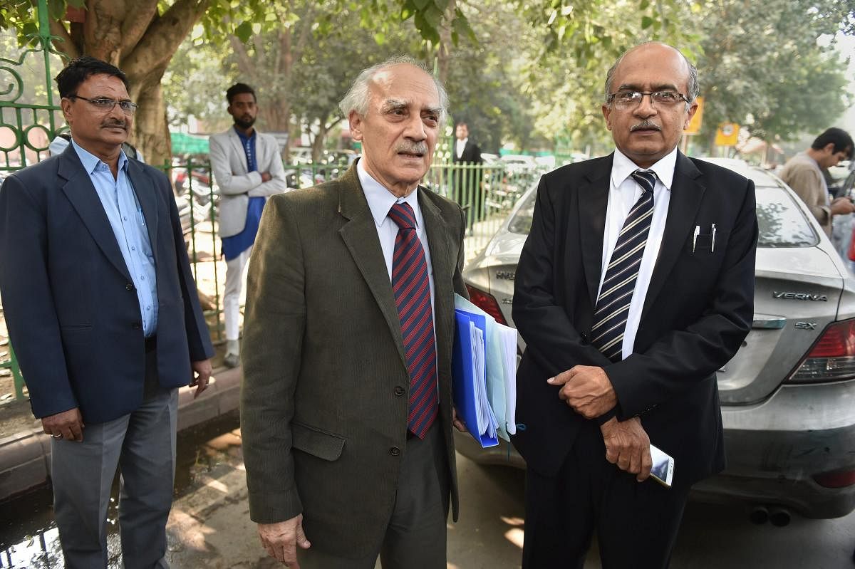 Senior lawyer Prashant Bhushan with former union minister Arun Shourie at the Supreme Court during a hearing on Rafale deal, in New Delhi, Wednesday. PTI photo
