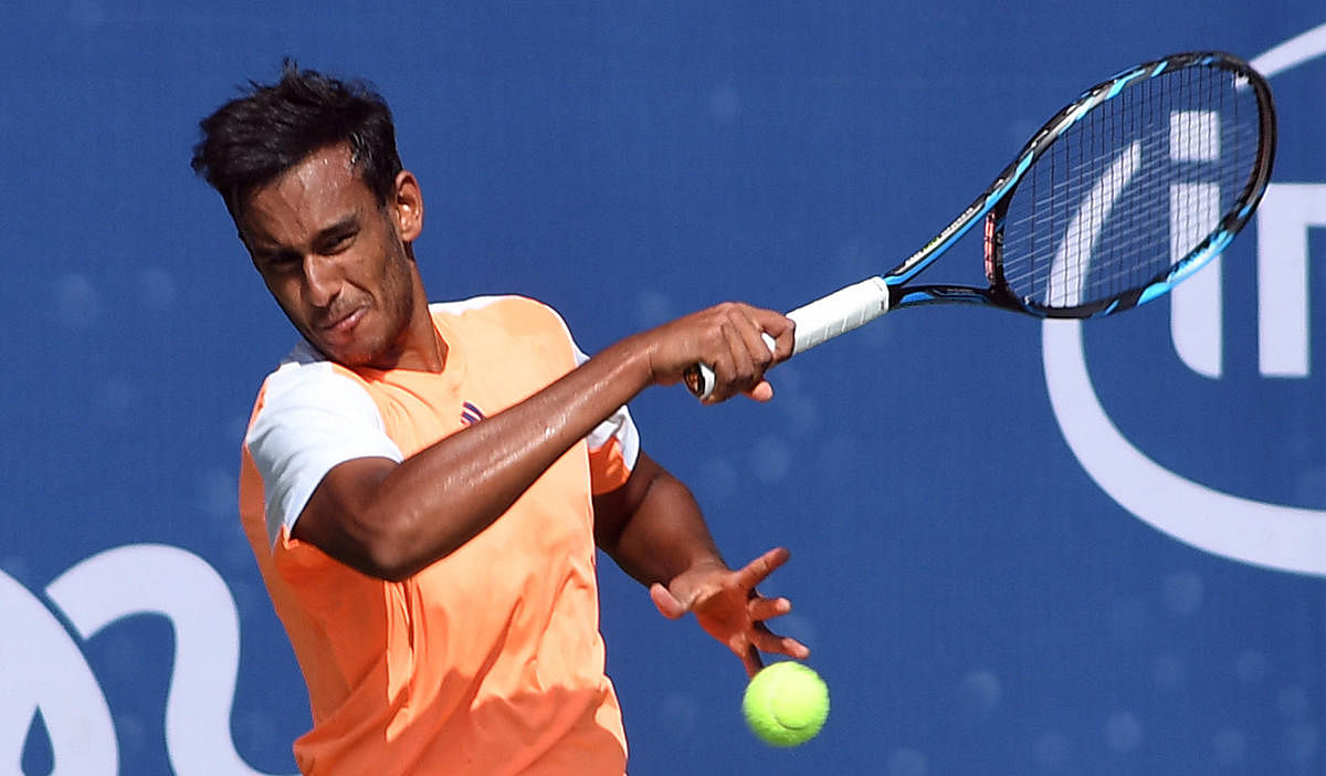 Sasi Kumar Mukund of India returns to Blaz Kavcic of Slovakia during their pre-quarterfinal match in Bengaluru on Wednesday. DH Photo/ Srikanta Sharma R