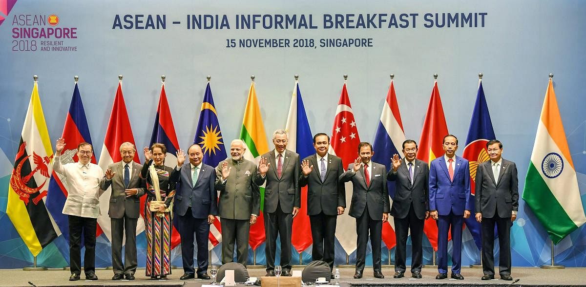 Prime Minister Narendra Modi with ASEAN leaders attends the ASEAN-India Informal Breakfast Summit, in Singapore, on Thursday. PTI