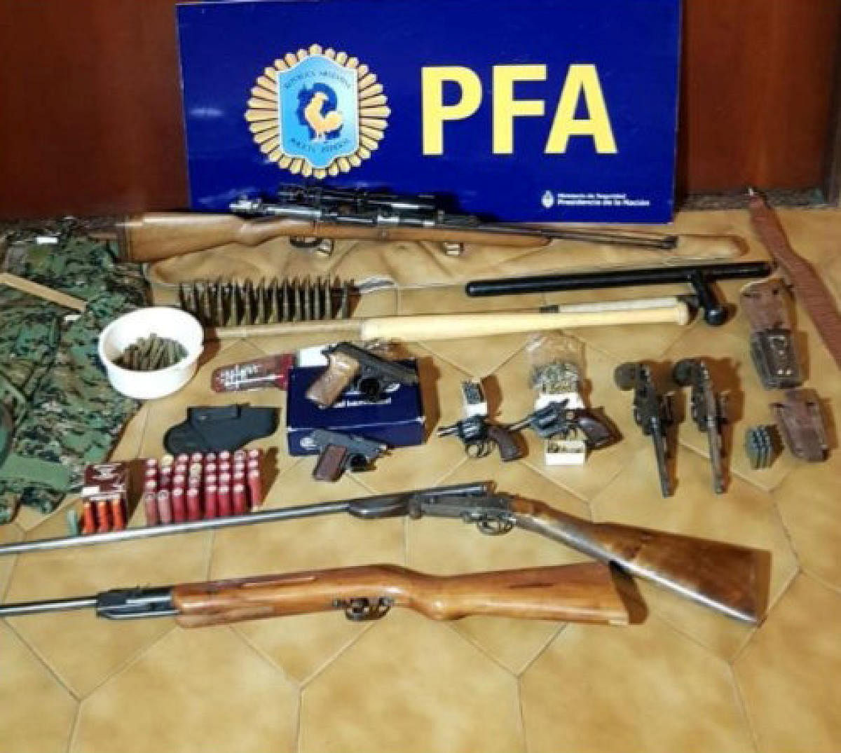 Weapons and ammunition that were found by Argentine police at the residence of two Argentine citizens with suspected links to Lebanon's Hezbollah militia are seen at the police headquarters in Buenos Aires. Reuters photo 
