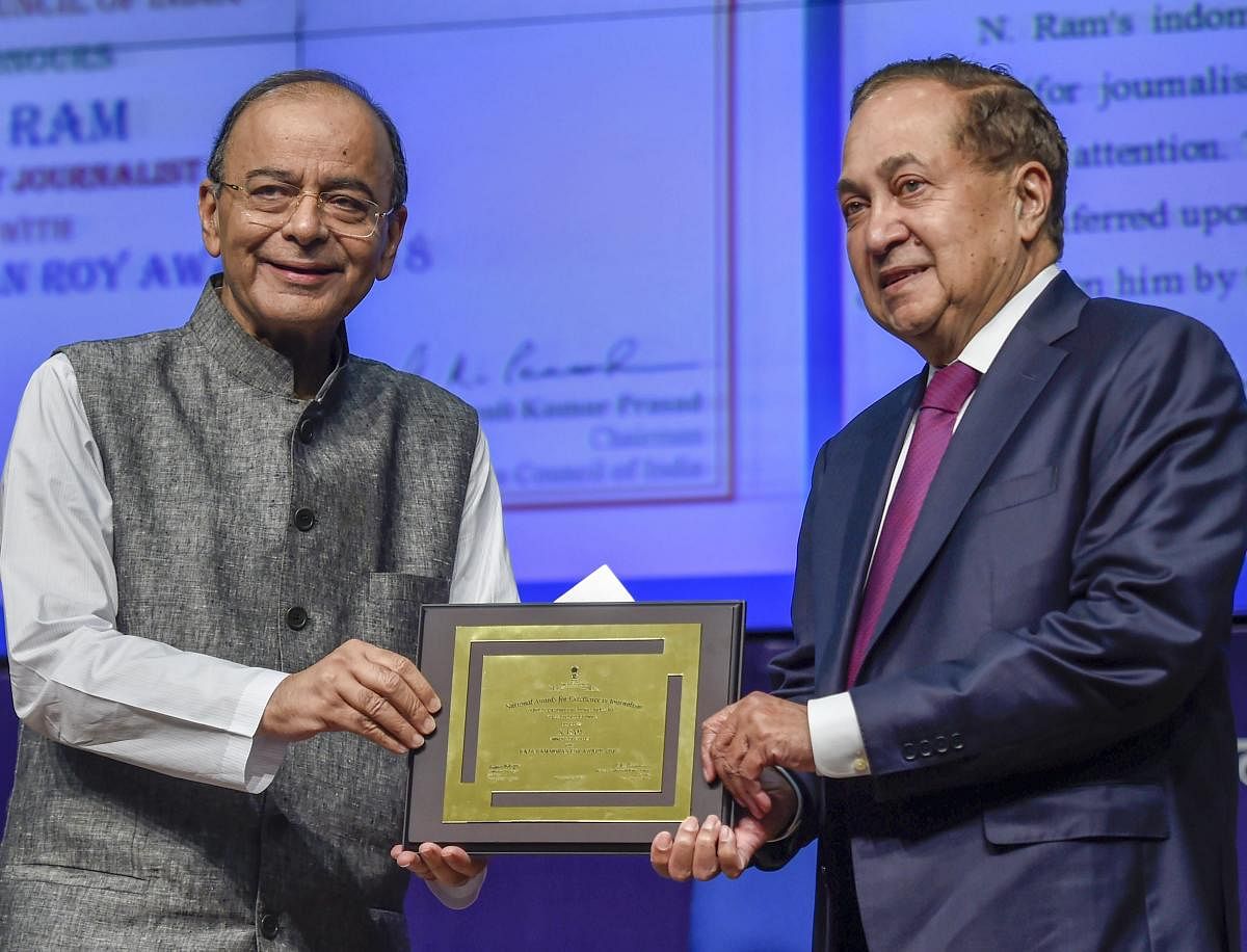 New Delhi: Finance Minister Arun Jaitley presents the 'Raja Ram Mohan Roy National Award for Excellence in Journalism' to Chairman, The Hindu Publishing Group of Newspapers, N Ram, during the National Press Day celebrations, in New Delhi, Friday. (PTI Pho