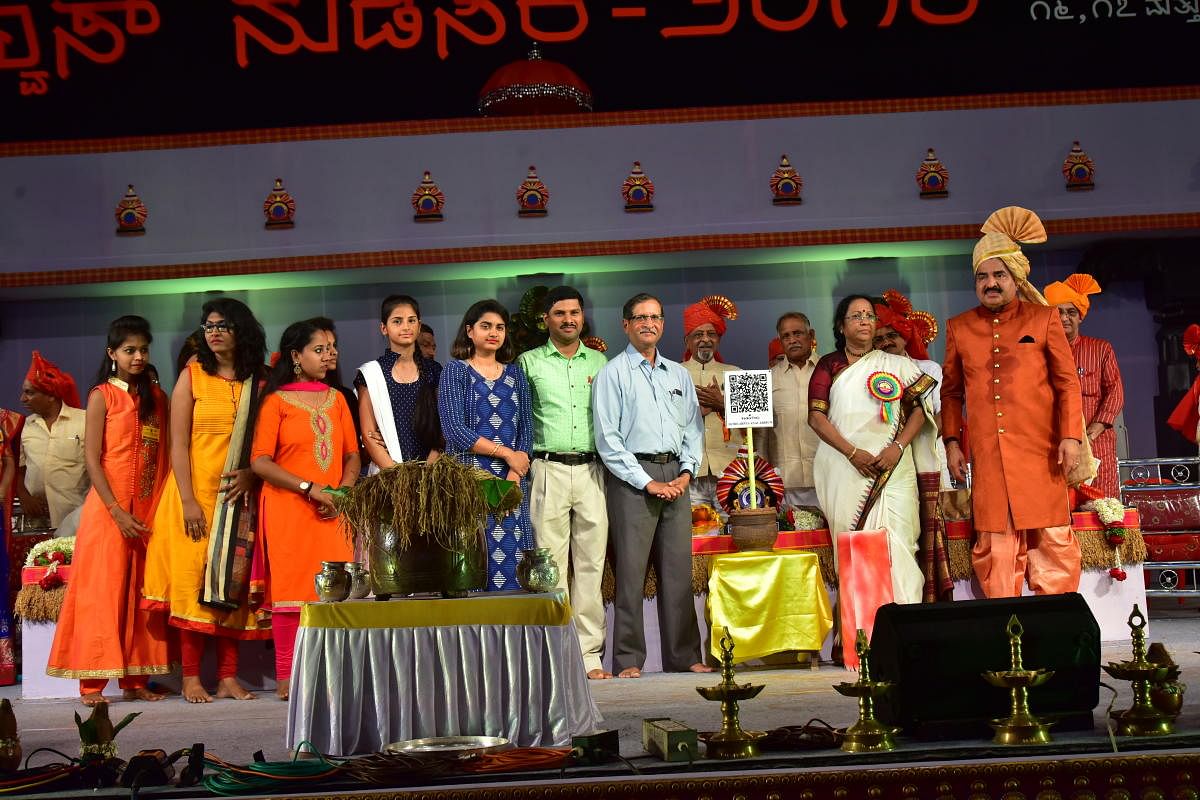 Kannada University Vice Chancellor Dr Mallika S Ghanti launches ‘Shobhavana QR code project’ during the inauguration of Alva's Nudisiri in Moodbidri on Friday. Alva’s Education Foundation Chairman Dr M Mohan Alva, project guide U B Pavanaja and othe