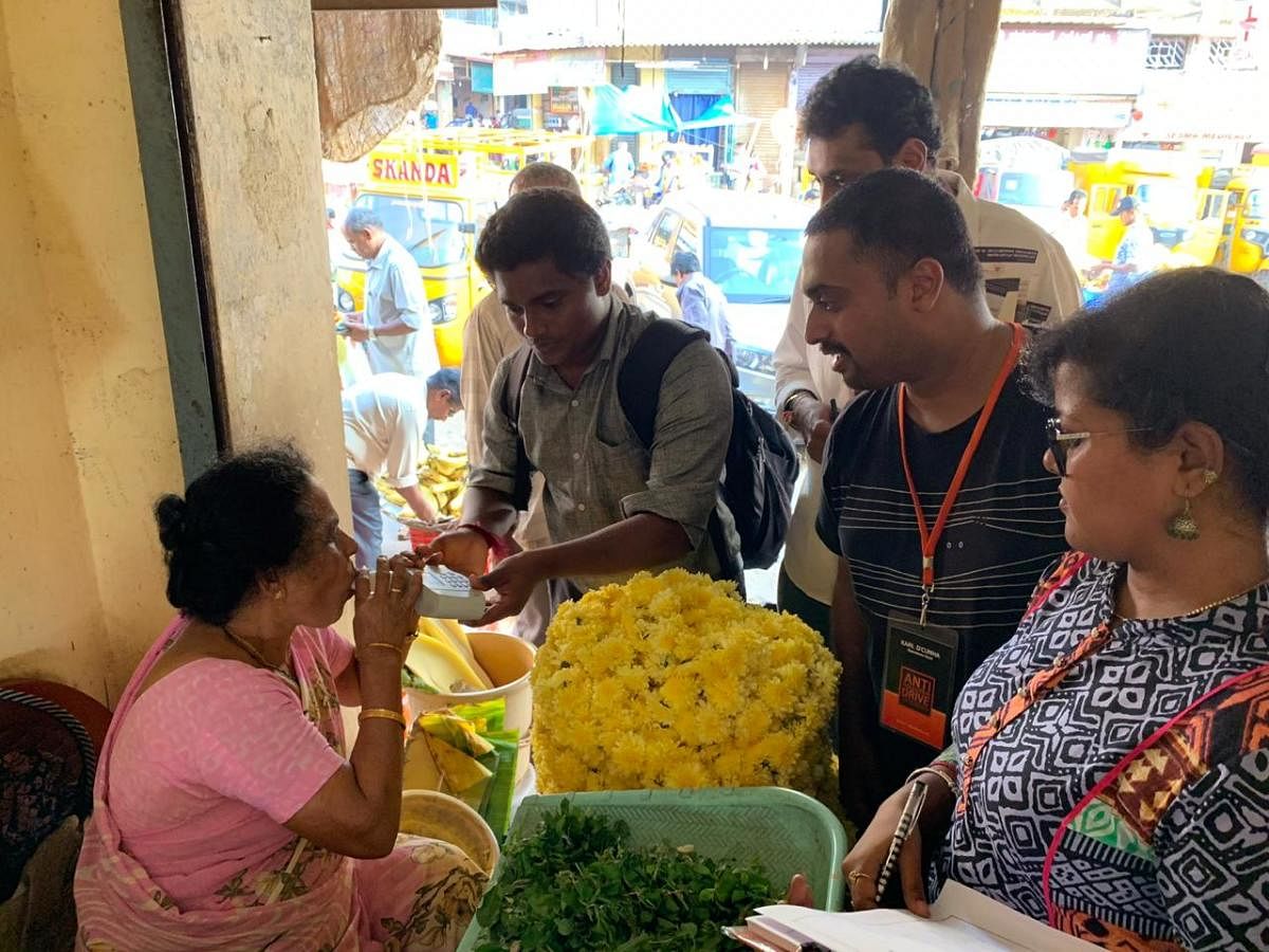 A Pulmonary Function Test being carried out on a flower vendor in Mangaluru.