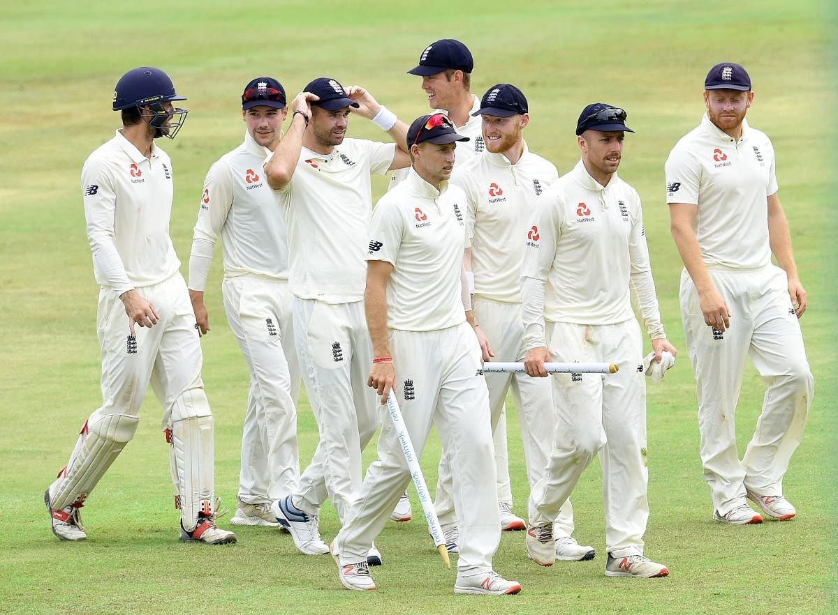 England players celebrate their win over Sri Lanka in the second Test at Kandy on Sunday. AFP