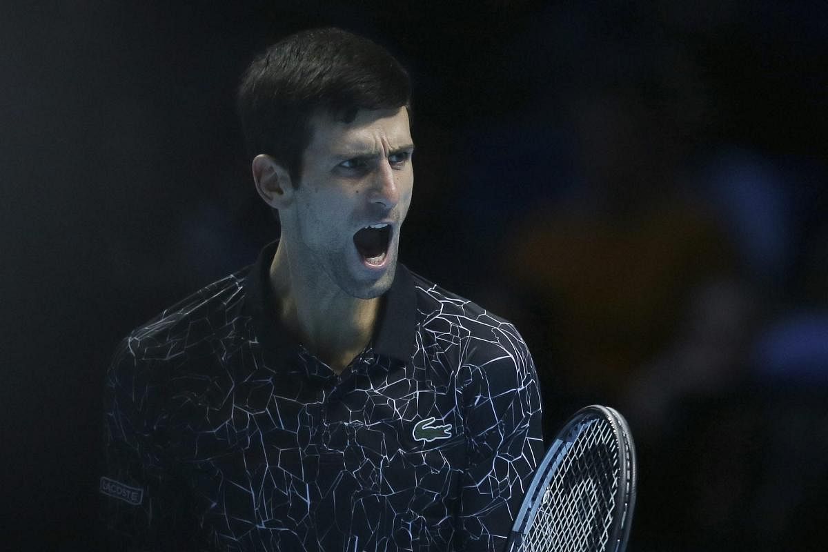 Serbian Novak Djokovic exults during his game against Kevin Anderson during an ATP World Tour Finals match on Saturday. AP/PTI