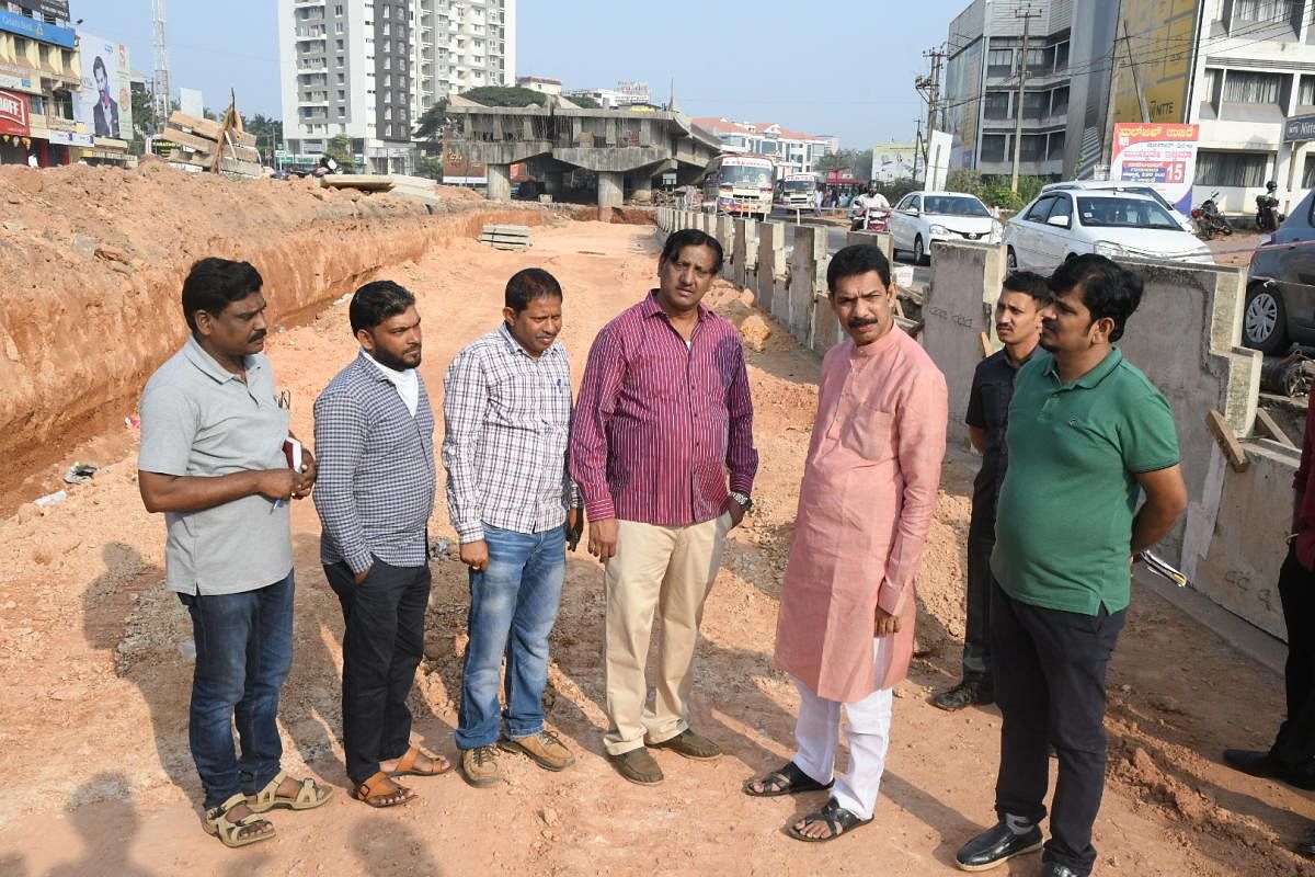 MP Nalin Kumar Kateel inspects the work on the flyover at Pumpwell in Mangaluru on Sunday. 