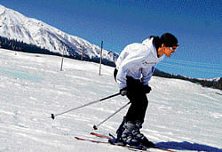A tourist gets ready to ski at Gulmarg in Jammu and Kashmir. Mehraj Bhat