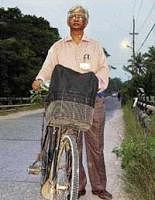 Adimurthy cycling to his office in Thiruvananthapuram