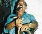 Dileep Chaurasia taking a snake bite.