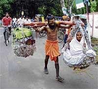Brahamahchari carries his mother in a basket.