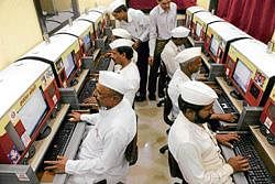 Dabbawalas take part in a computer class in Mumbai.