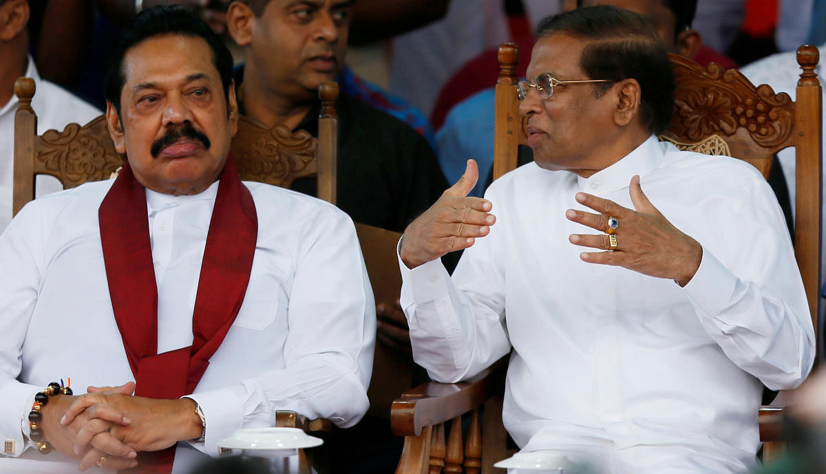 Sri Lanka's newly appointed Prime Minister Mahinda Rajapaksa and President Maithripala Sirisena talk during a rally near the parliament in Colombo, Sri Lanka November 5, 2018. (REUTERS File Photo)