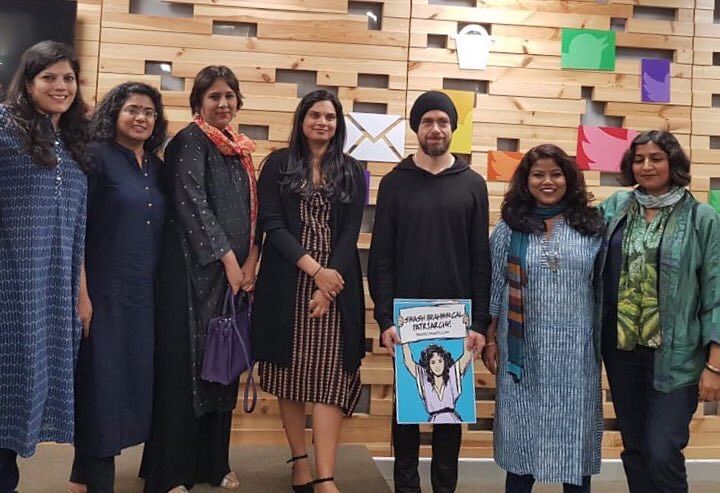Twitter CEO Jack Dorsey with a poster saying "Smash Brahmin Patriarchy" poses for a photo. (Credit: Twitter)