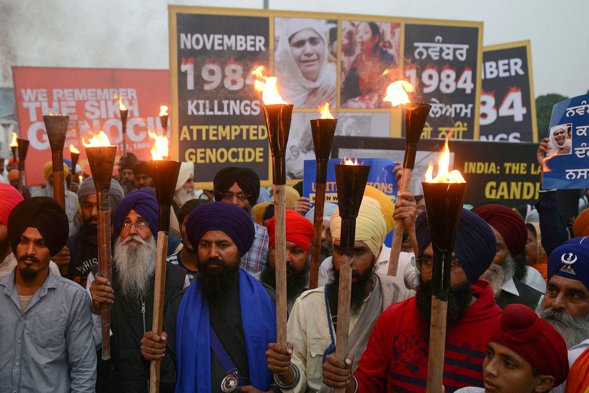 (FILES) In this file photo taken on November 3, 2018 Indian activists of the Dal Khalsa radical Sikh organization march at a protest to commemorate the 1984 anti-Sikh riots in Amritsar. - An Indian court on November 20, 2018 handed down first death penalt