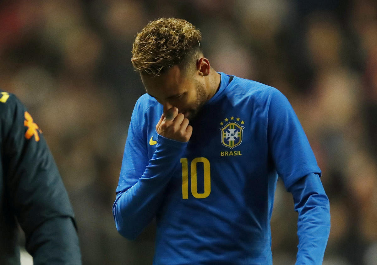 Brazil's Neymar leaves the pitch after suffering an injury. Reuters