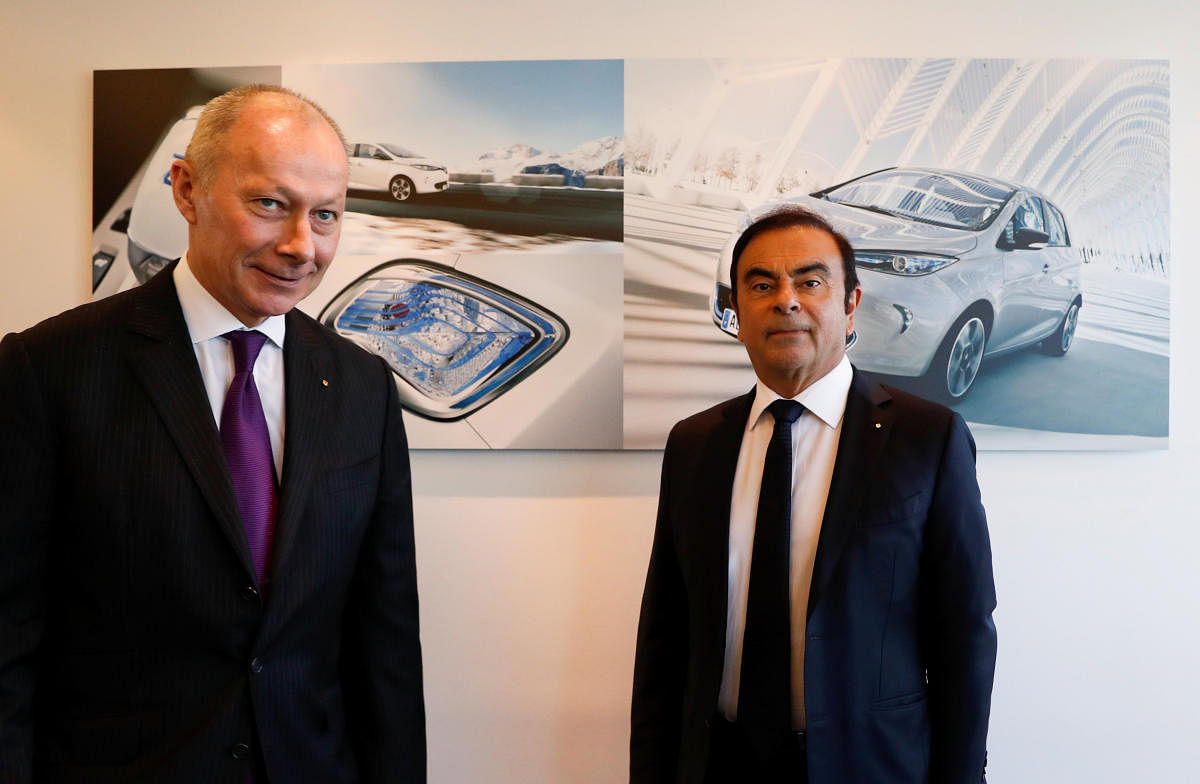 Carlos Ghosn (L), Chairman and Chief Executive Officer of Renault, and Thierry Bollore, Renault Chief Operating Officer, attend the French carmaker Renault's 2017 annual results presentation at their headquarters in Boulogne-Billancourt, near Paris, Franc