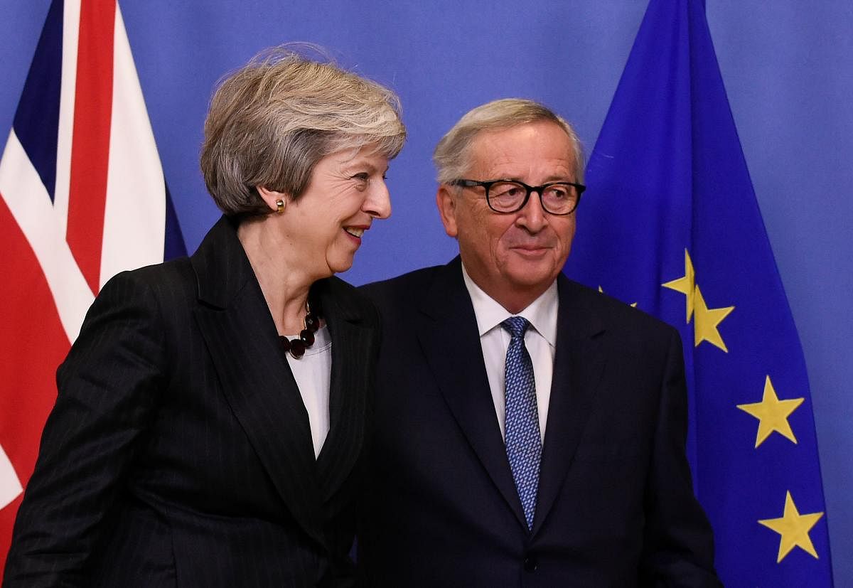 EU Commission President Jean-Claude Juncker and British Prime Minister Theresa May during a meeting at the EU Headquarters in Brussels on November 21, 2018. (AFP Photo)
