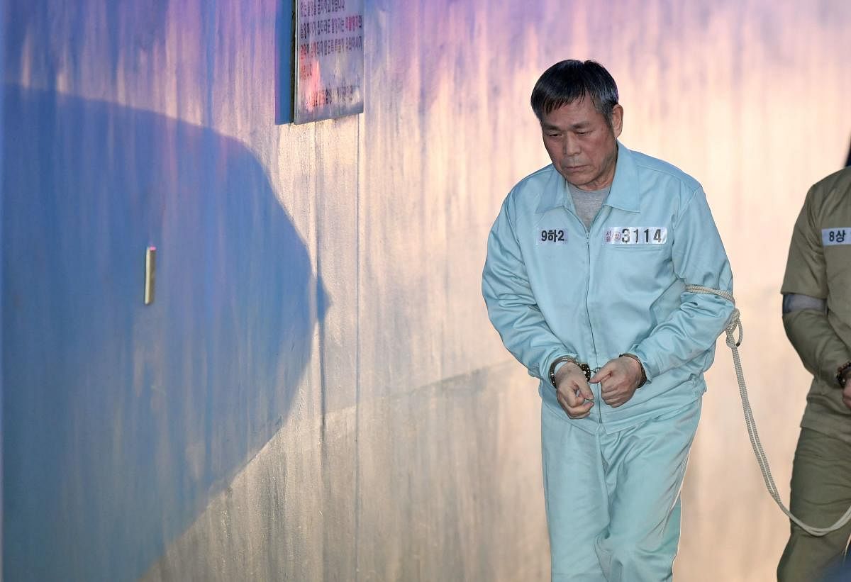 South Korean pastor Lee Jaerock arrives at the Seoul Central District Court to attend his trial in Seoul on November 22, 2018. - The South Korean cult leader was convicted on November 22 of the multiple rape of eight female followers - some of whom believ