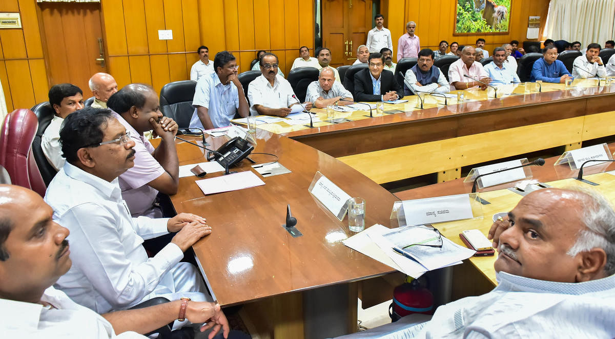 Chief Minister Kumaraswamy speaks at a meeting of sugar factory owners in Bengaluru on Thursday. Deputy Chief Minister Parameshwara is also seen.