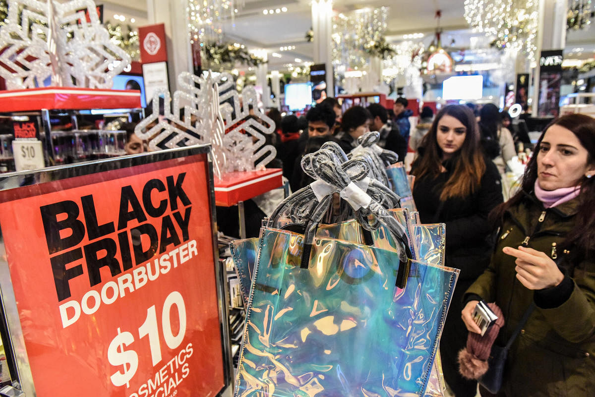 People shop during a Black Friday sales event at Macy's flagship store on 34th St. in New York City, U.S., November 22, 2018. REUTERS/Stephanie Keith