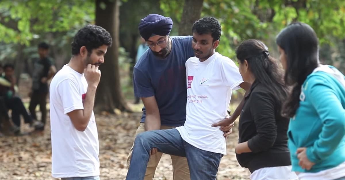 HELPING HAND: A dance instructor trains children with disabilities to dance at Cubbon Park.