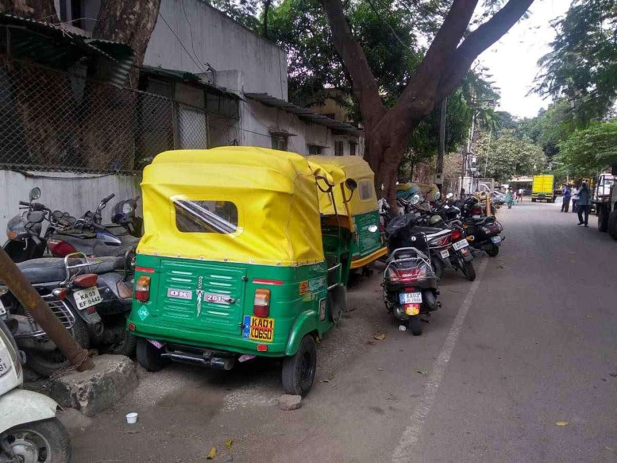 Blocked: The footpaths near the Jeevan Bima Nagar police station are jam-packed with vehicles seized by the traffic police, making it difficult for the pedestrians.