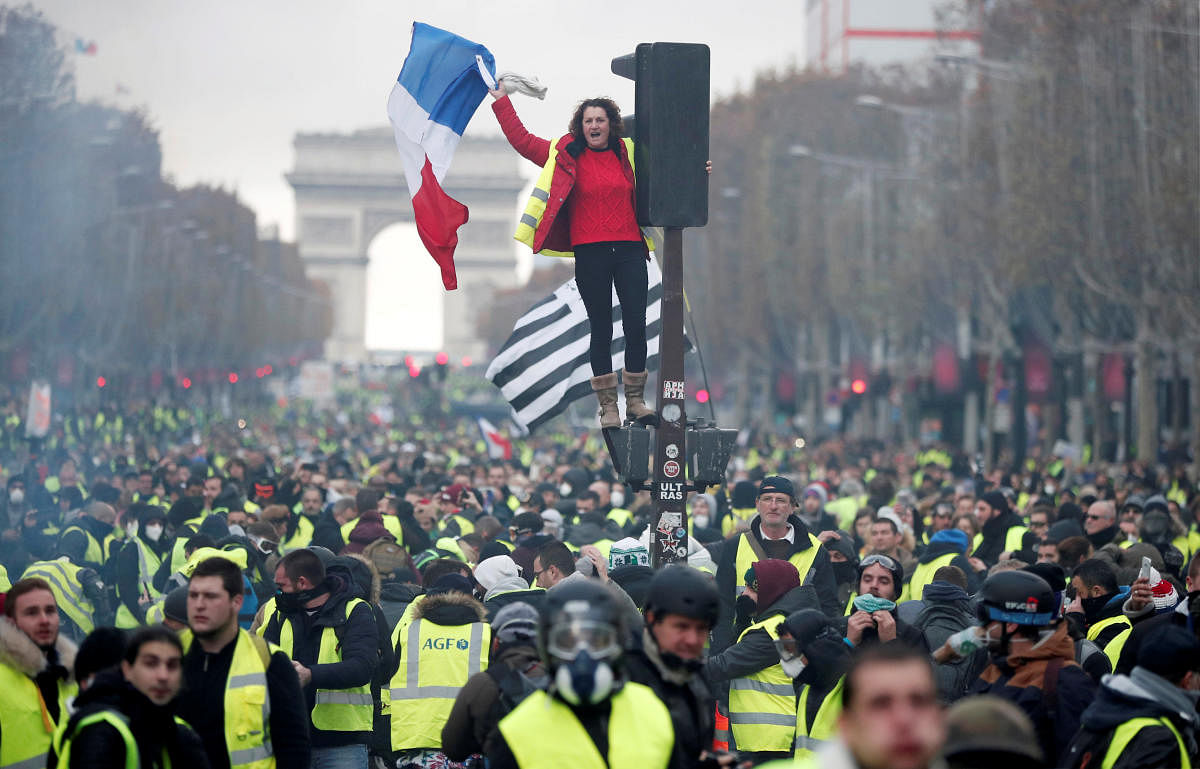Thousands protest against higher fuel prices and tax on the Champs-Elysee in Paris, France, on November 24, 2018. Reuters