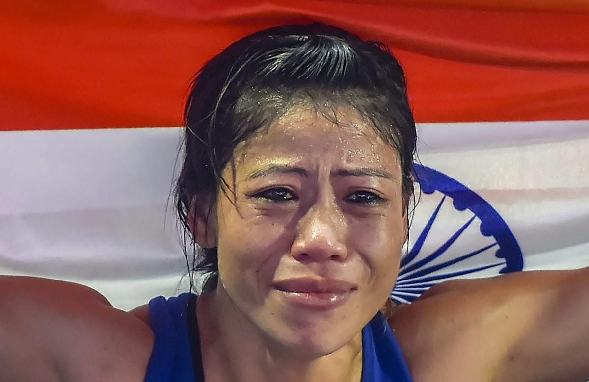 Indian boxer Mary Kom gets emotional as she celebrates after winning the final match of women's light flyweight 45-48 kg against Ukraine's Hanna Okhota at AIBA Women's World Boxing Championships, in New Delhi, Saturday, November 24, 2018. (PTI Photo)