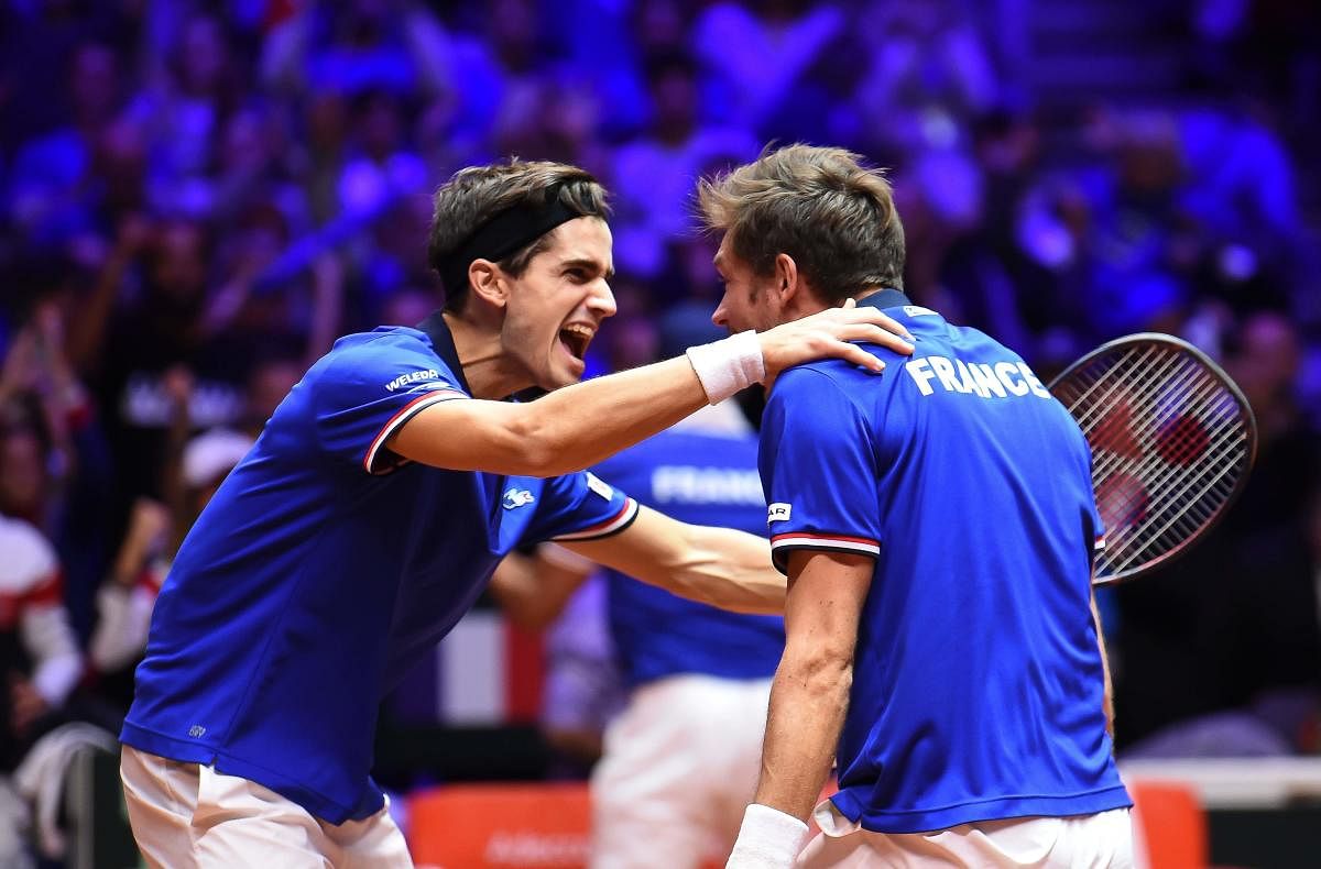 Joyous: France's Pierre-Hugues Herbert (left) and Nicolas Mahut celebrate after beating Croatia's Ivan Dodig and Croatia's Mate Pavic in their doubles match on Saturday. AFP