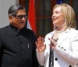 US Secretary of State Hillary Clinton (R) gestures while talking with Indian Foreign Minister S.M. Krishna prior to delegation level talks in New Delhi on July 19, 2011. US Secretary of State Hillary Clinton looked to ramp up regional security cooperation and trade ties in talks with Indian leaders July 19, held in the shadow of triple bomb blasts in Mumbai. India's concerns over the US troop drawdown in Afghanistan and its renewed peace talks with arch-rival Pakistan are expected to figure in the US-India "strategic dialogue" in New Delhi. AFP
