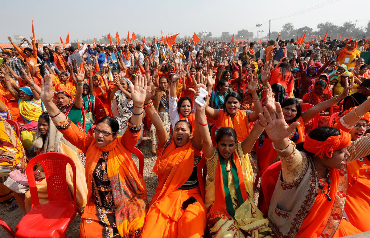 VHP supporters shout slogans during 'Dharma Sabha' in Ayodhya on Sunday. REUTERS