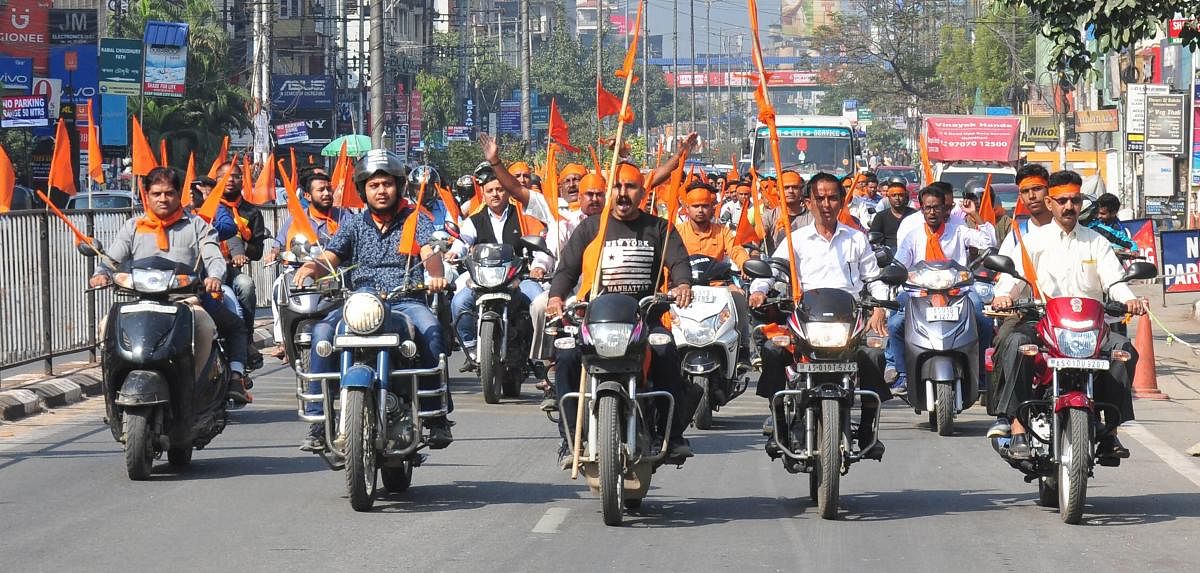 Vishwa Hindu Parishad activists participate in a bike rally amid 'Dharam Sabha’, being organised by the Vishwa Hindu Parishad to push for the construction of the Ram temple at Ayodhya, in Guwahati on Sunday. PTI
