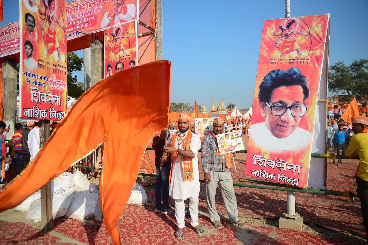 Shiv Sena activists wave a flag at Lakshman Qila during an event for the construction of Ram temple in Ayodhya on November 24, 2018. (AFP File Photo)