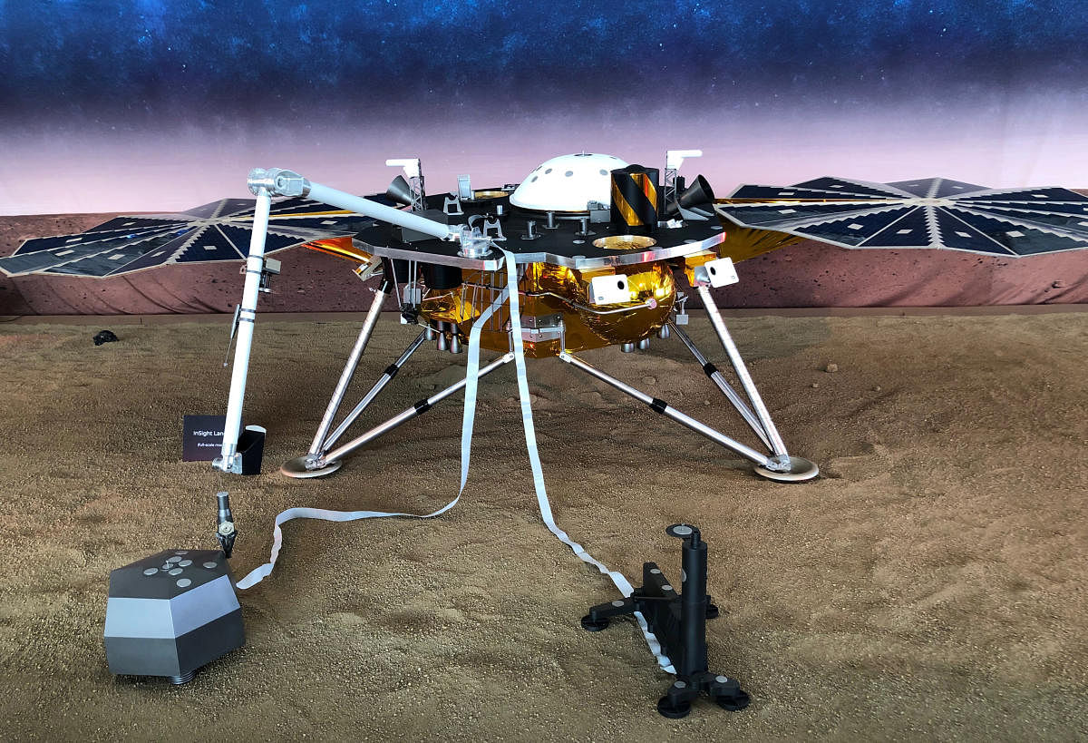 A full-scale replica of NASA's Mars InSight, a robotic stationary lander that marks the first spacecraft designed to study the deep interior of the Red Planet, or any distant world, is seen inside a large tent on the campus of NASA's Jet Propulsion Labora