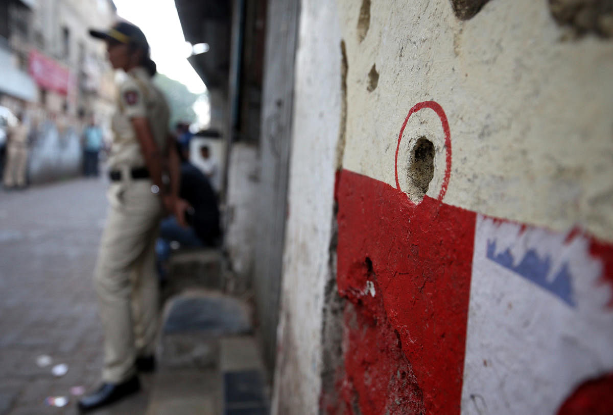 A bullet hole in a wall opposite to the Nariman House, one of the targets of the November 26, 2008 attacks, is pictured after the renaming of Nariman House as Nariman Light House in Mumbai, India, November 25, 2018. REUTERS/Francis Mascarenhas
