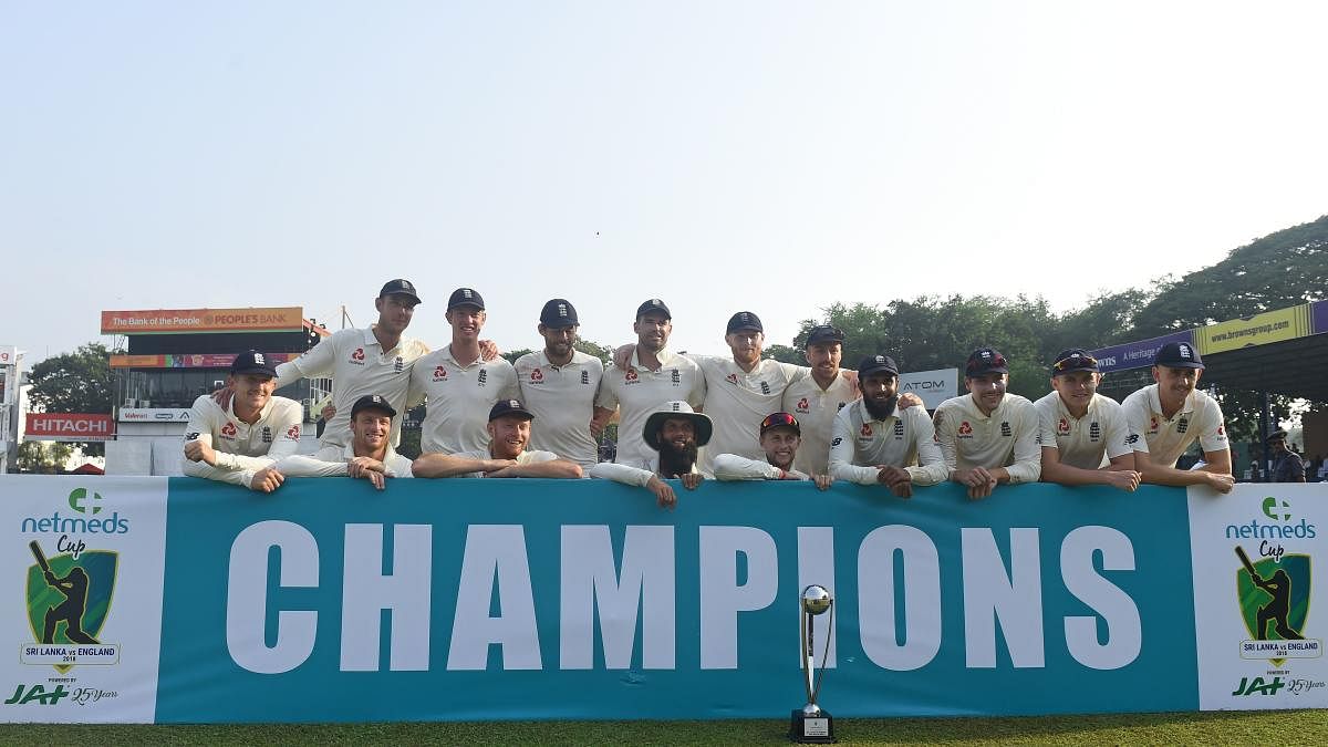England team with the trophy after winning the Test series against Sri Lanka in Colombo on Monday. AFP