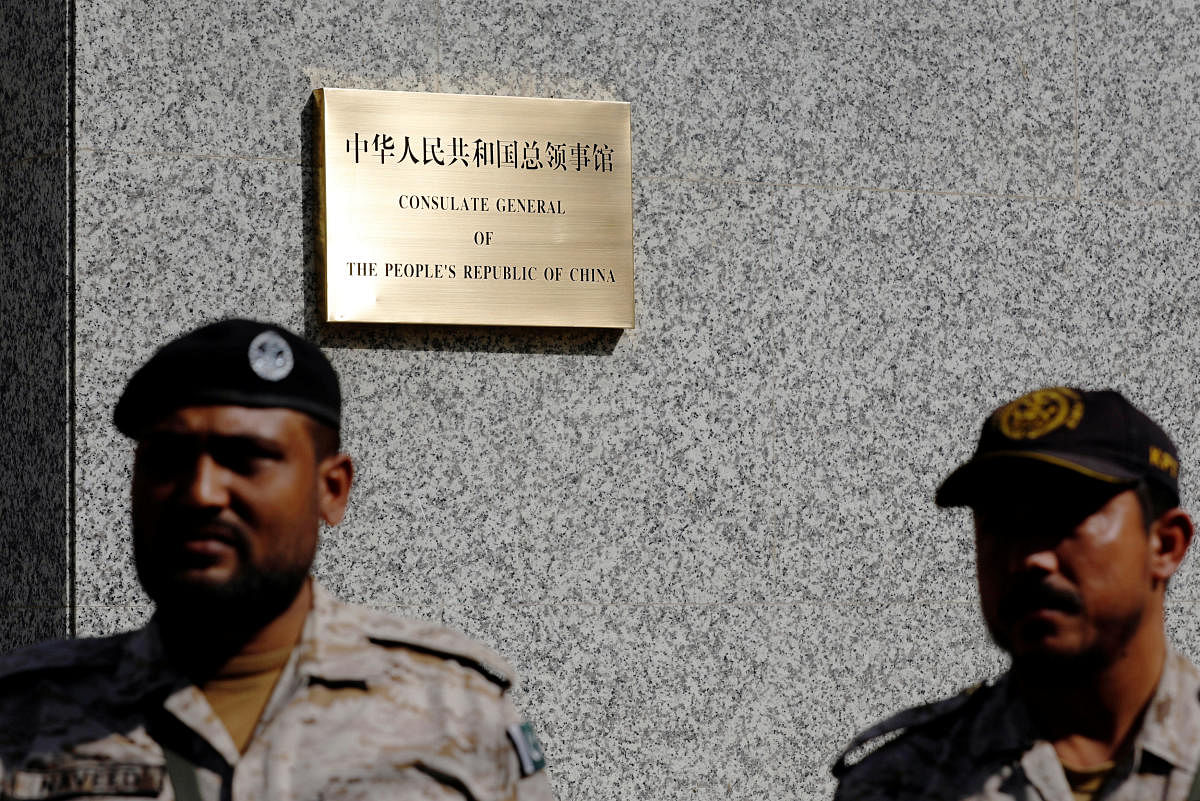 Paramilitary soldiers stand guard outside, after an attack on the Chinese consulate, in Karachi, Pakistan. REUTERS