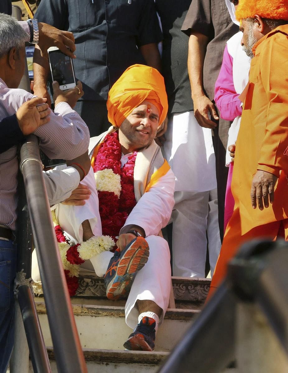 Congress President Rahul Gandhi leaves after offering prayers at Brahma Temple in Pushkar on Monday. PTI