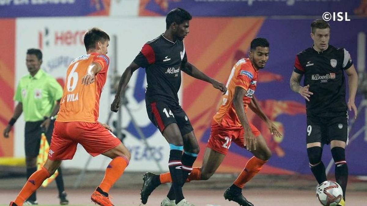 FC Pune City (orange) and NorthEast FC United players in action in an ISL game. ISL MEDIA