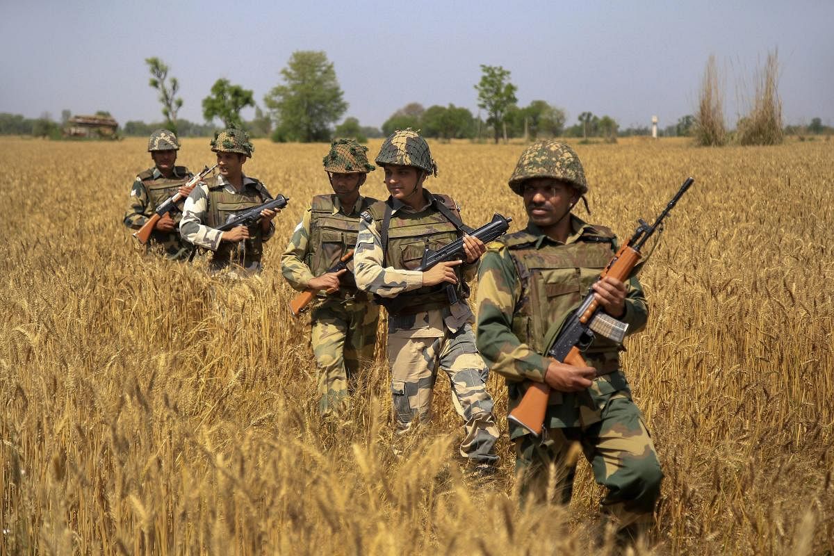 BSF personnel patrol along the international border in Jammu. (PTI File Photo)