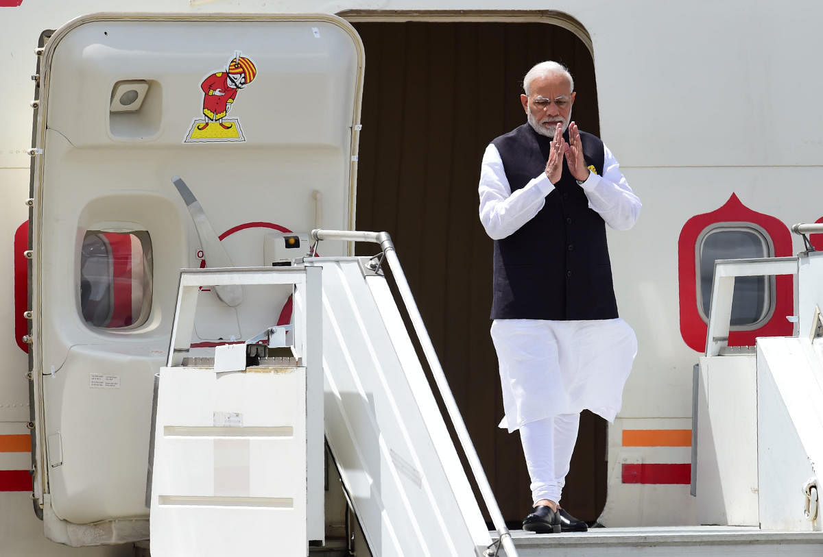 India's Prime Minister Narendra Modi steps off his plane upon arrival at Ezeiza International airport in Buenos Aires province, on November 29, 2018. - Global leaders gather in the Argentine capital for a two-day G20 summit beginning on Friday likely to b