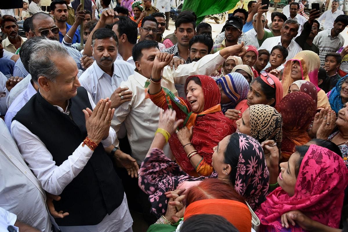 Congress leader and former chief minister Ashok Gehlot interacts during an election campaign in his home constituency of Sardarpura in Jodhpur on November 20. PTI
