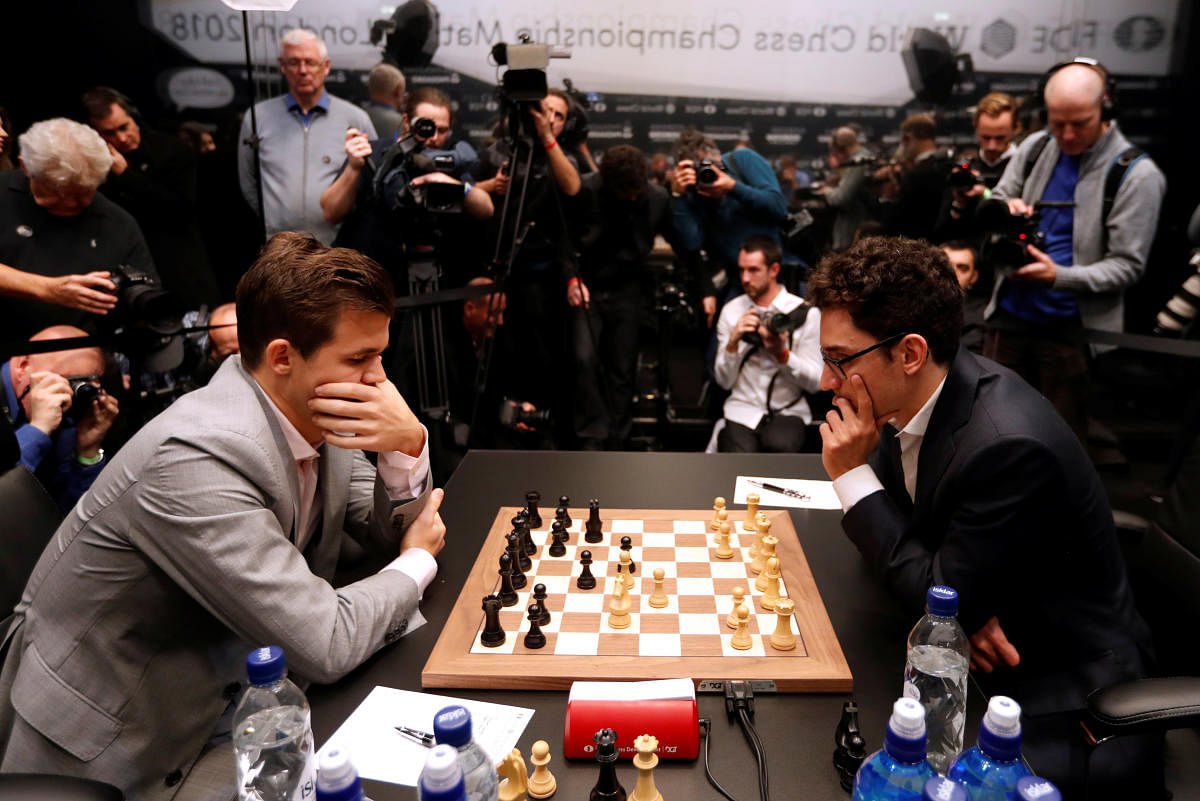 USA's Fabiano Caruana (right) and Norway's Magnus Carlsen (left) during round 12 of the World Chess Championship Final. REUTERS